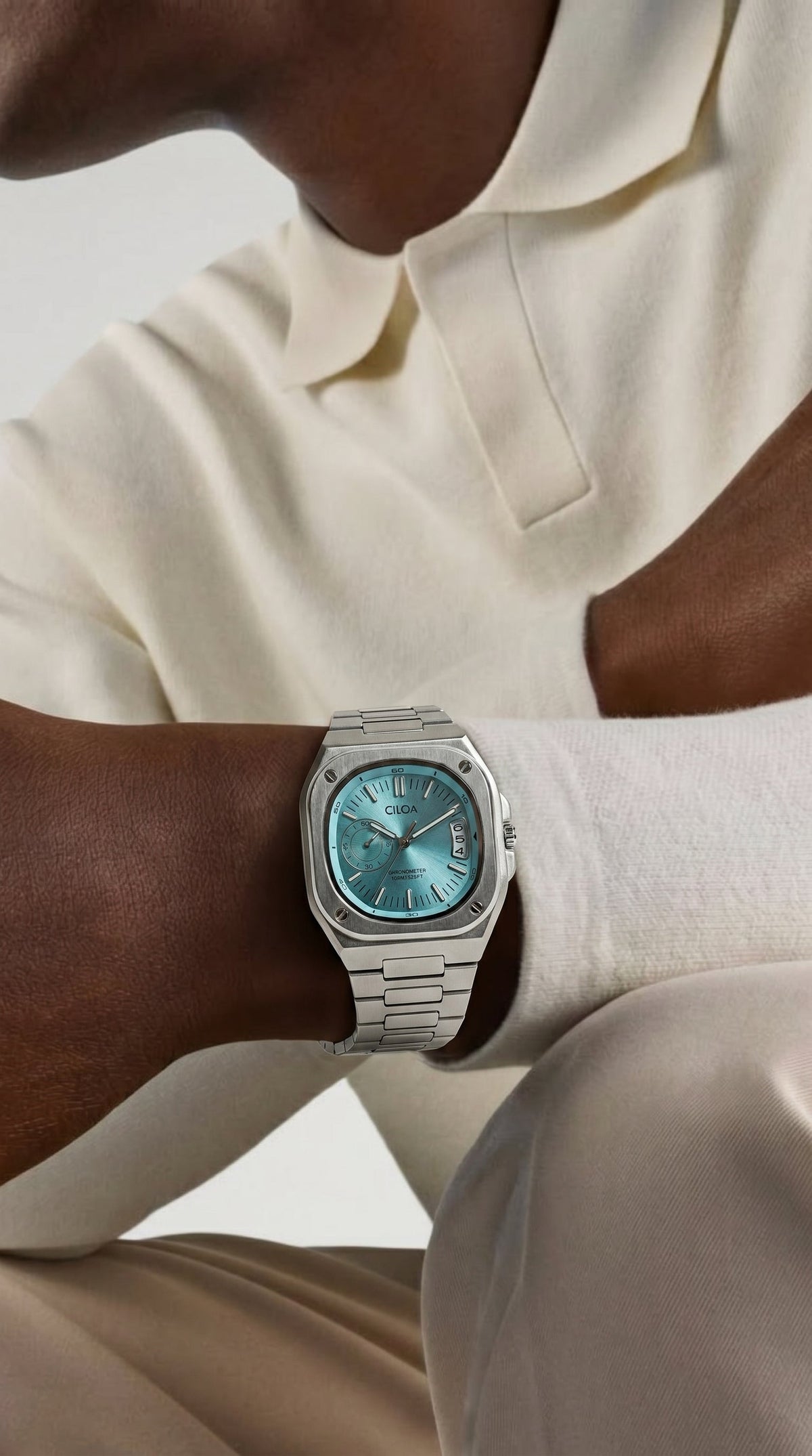 CILOA Marine with stainless steel bracelet worn with a white shirt